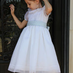 Susanne Lively Organza dress with ruffle collar. White/pink sash