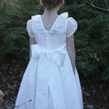 Susanne Lively Organza dress with ruffle collar. White/pink sash