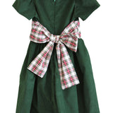 Back of the Susanne Lively green corduroy dress with the ivory tartan sash tied in a large bow
