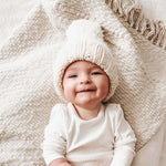 Cream Classic Pom Hat styled for winter