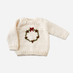 The Blueberry Hill cream hand-knit Wreath Sweater with embroidered green wreath and red berries