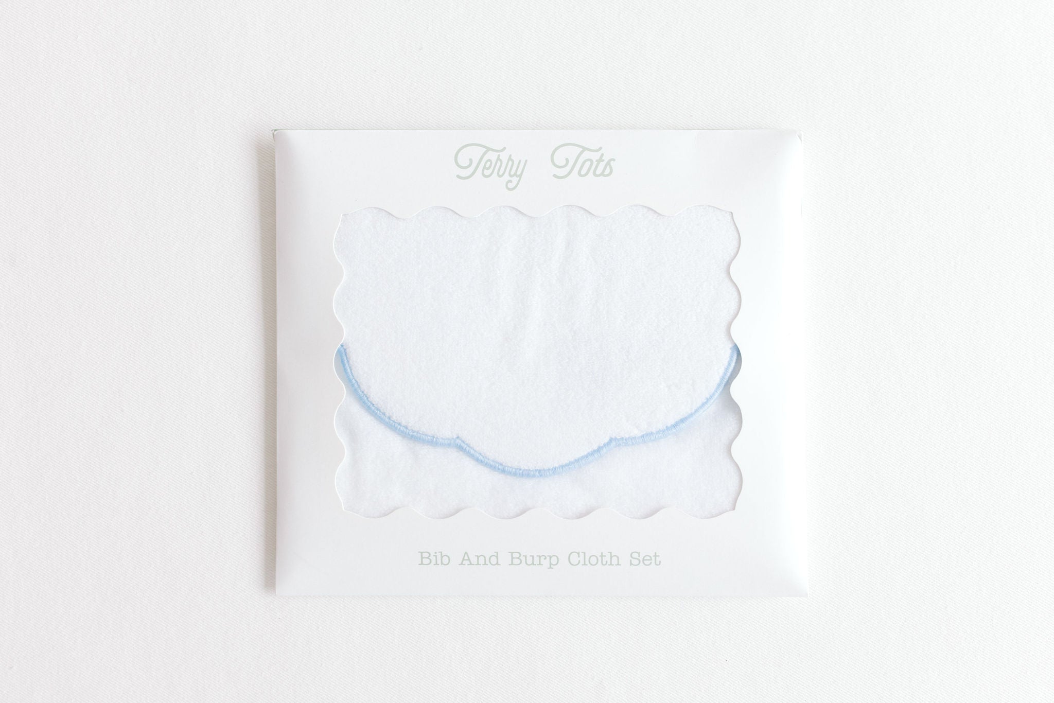 Terry Tots blue scalloped bib and burp set, alternate view