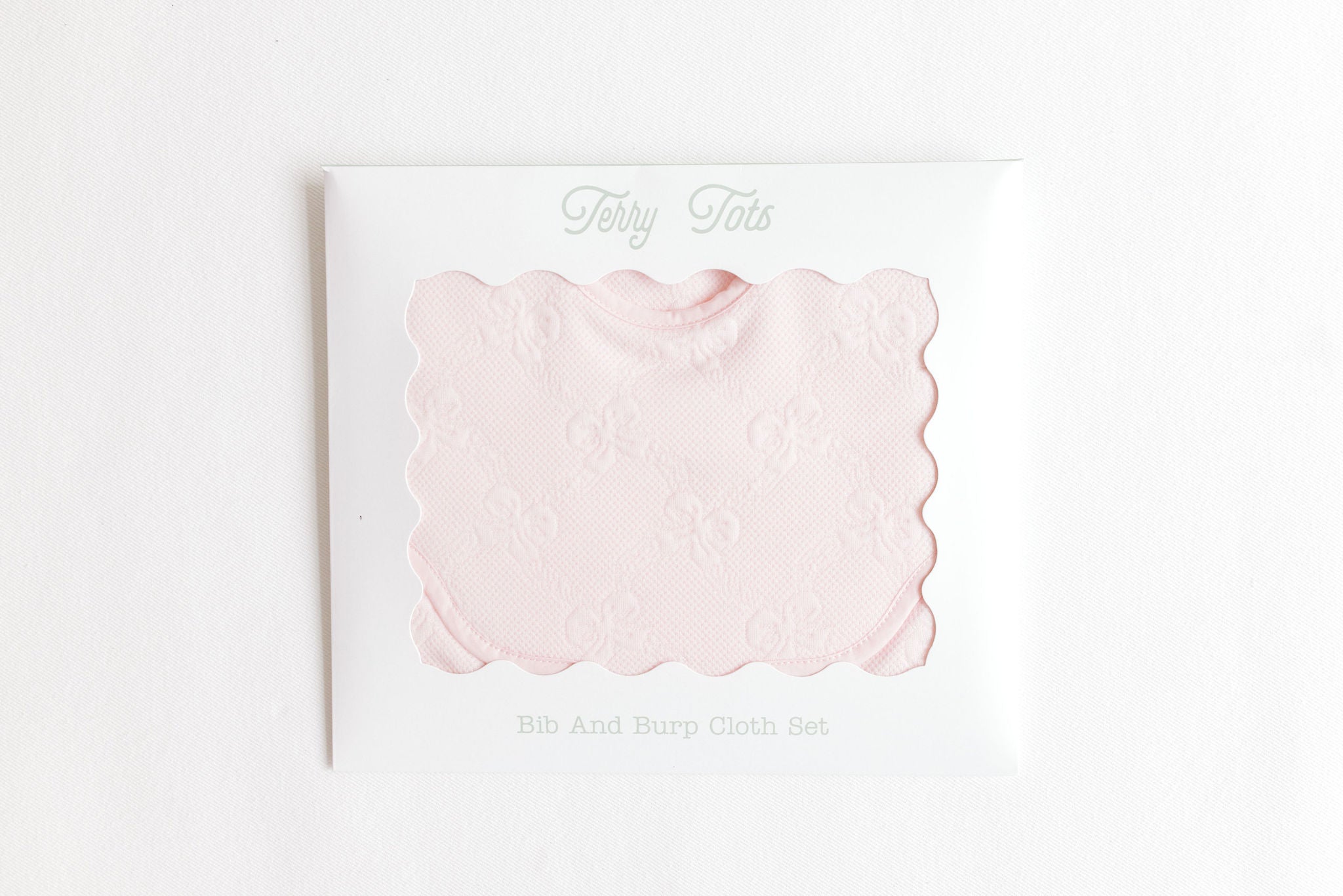 Terry Tots pink jacquard bows bib and burp set, alternate view