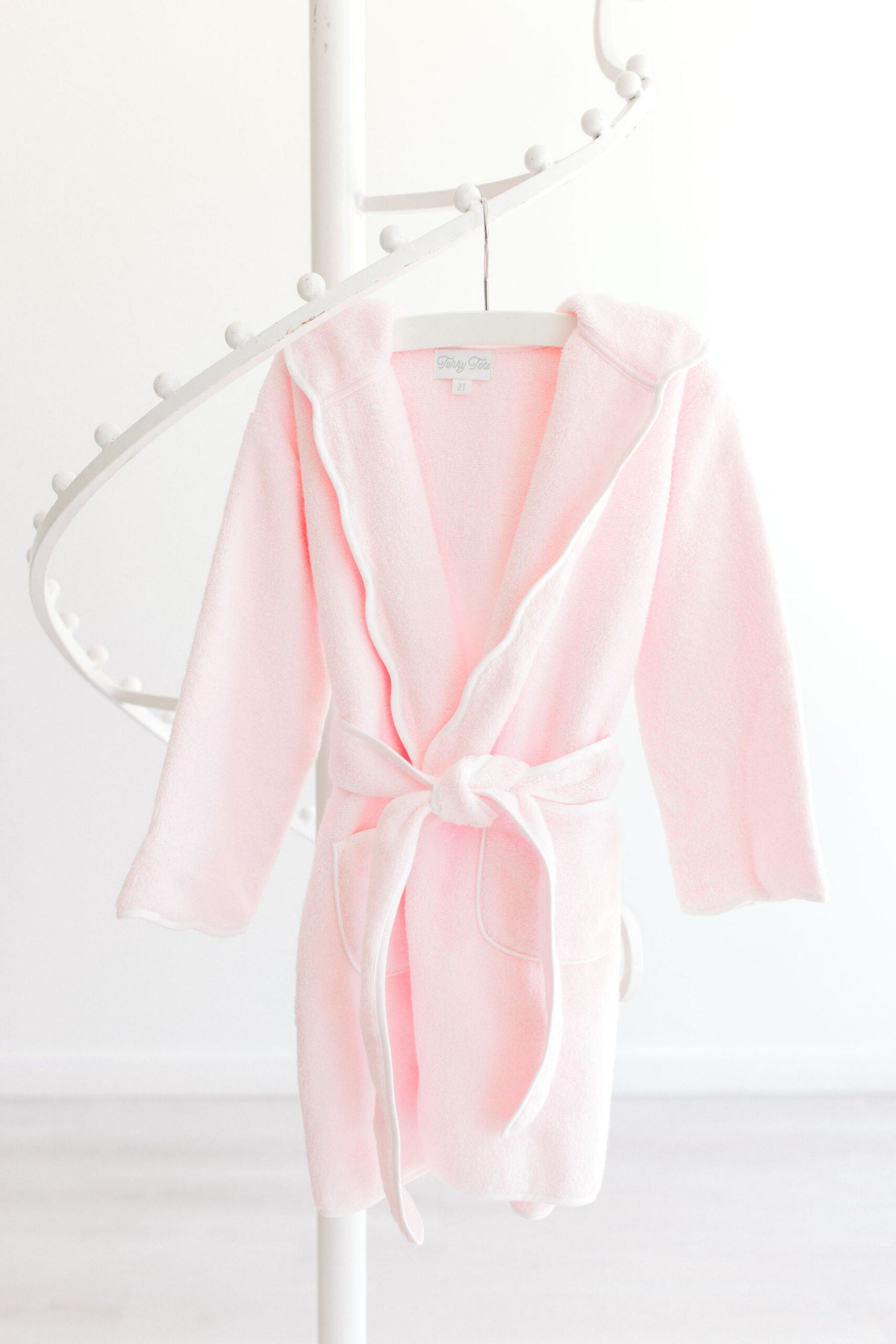 Terry Tots pink terry bathrobe with white scalloped trim and hood