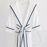 Terry Tots white terry bathrobe with navy trim and hood