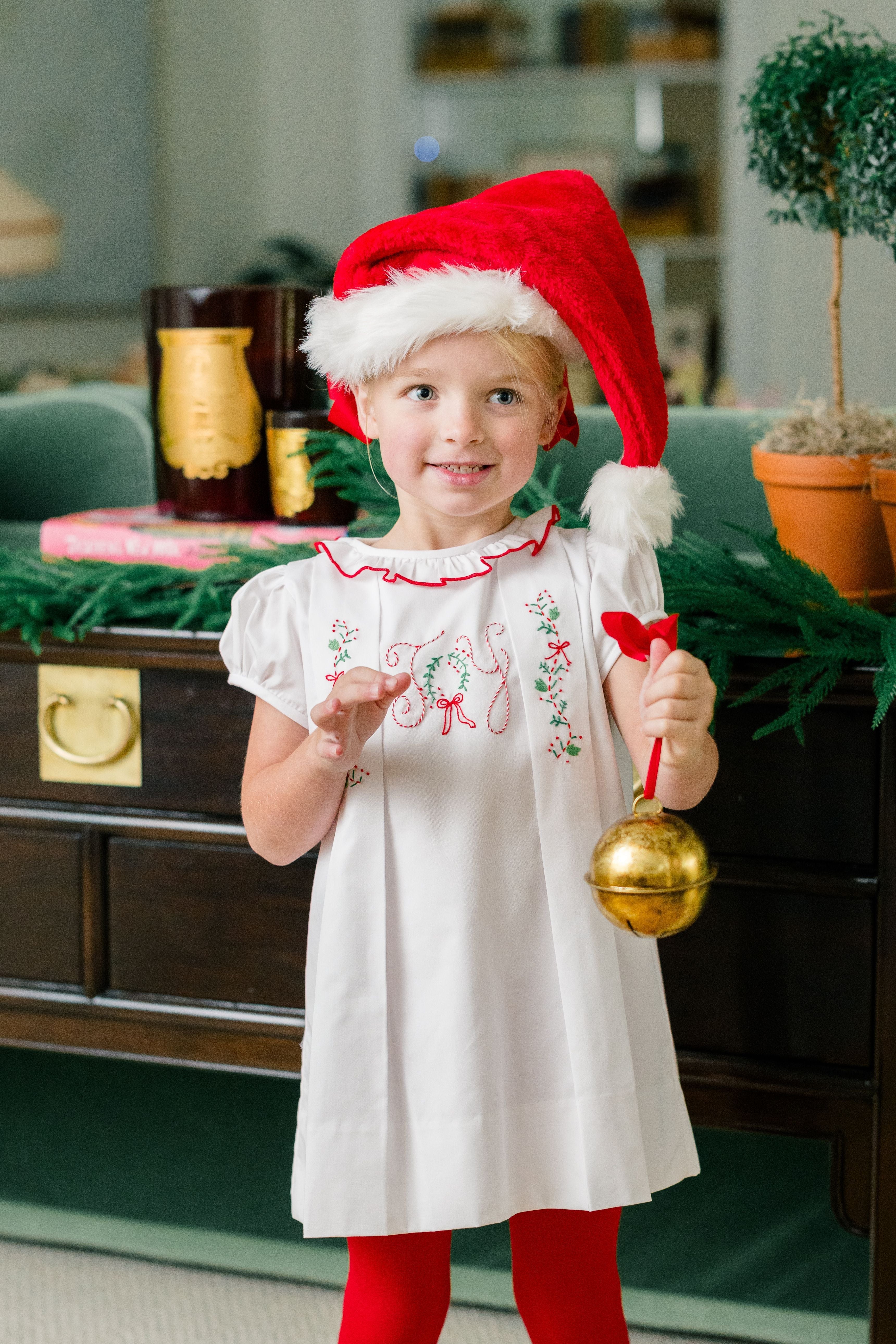 The Proper Peony Joyful Dress, white Christmas dress with red accents and hand embroidery