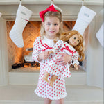 Girl and her doll in matching Whimsical Santa Emersyn dresses