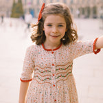 Elysée smocked dress with holly and berry hand smocking and crocheted Peter Pan collar