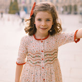 Elysée smocked dress with holly and berry hand smocking and crocheted Peter Pan collar