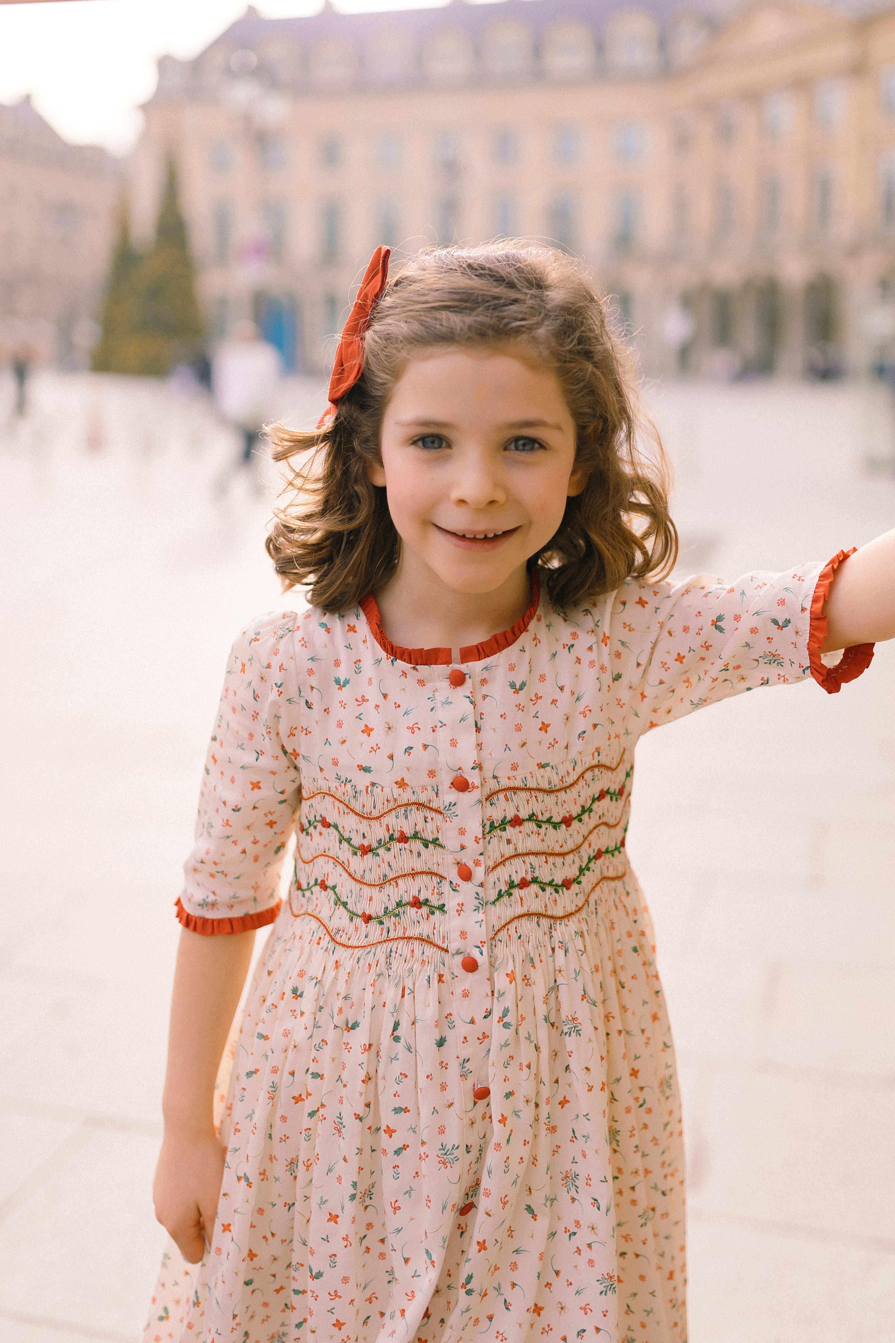 Elysée smocked dress with holly and berry hand smocking and crocheted Peter Pan collar