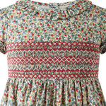 Hand-smocked bodice detail on Rachel Riley Apple Blossom dress