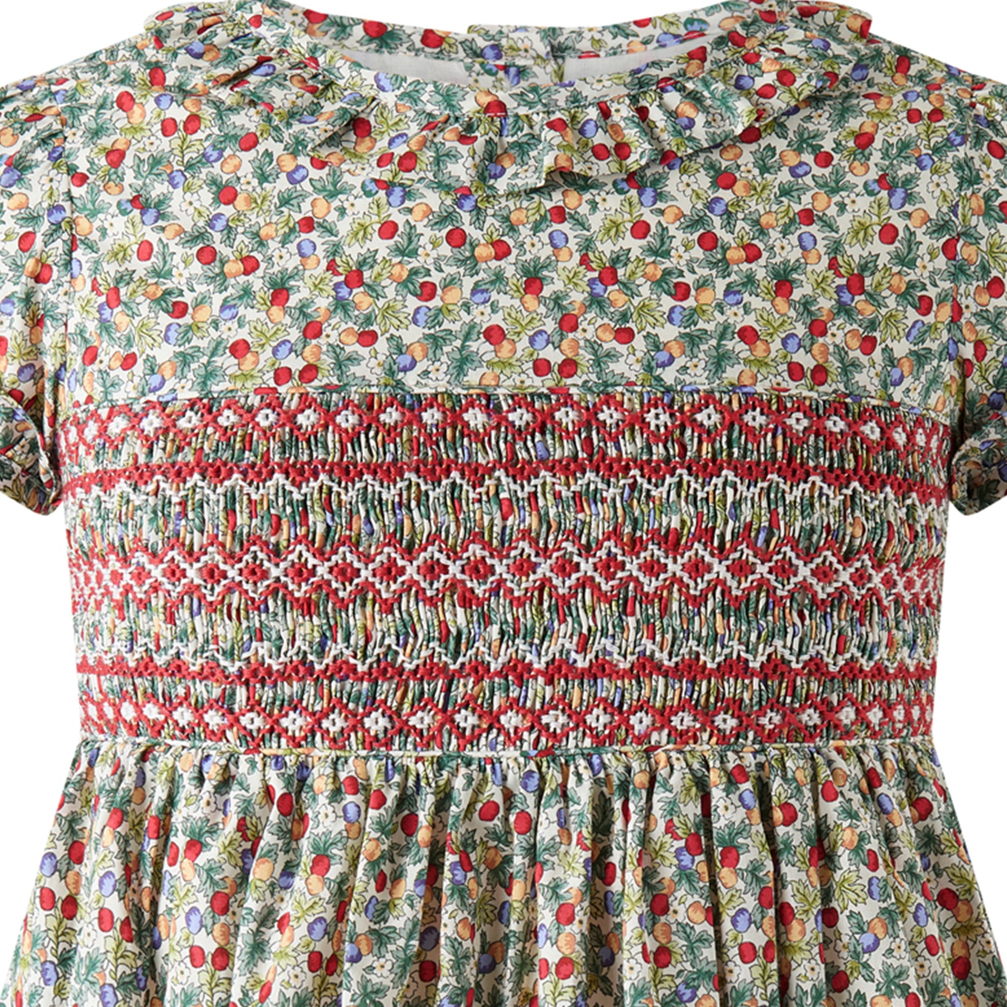 Hand-smocked bodice detail on Rachel Riley Apple Blossom dress