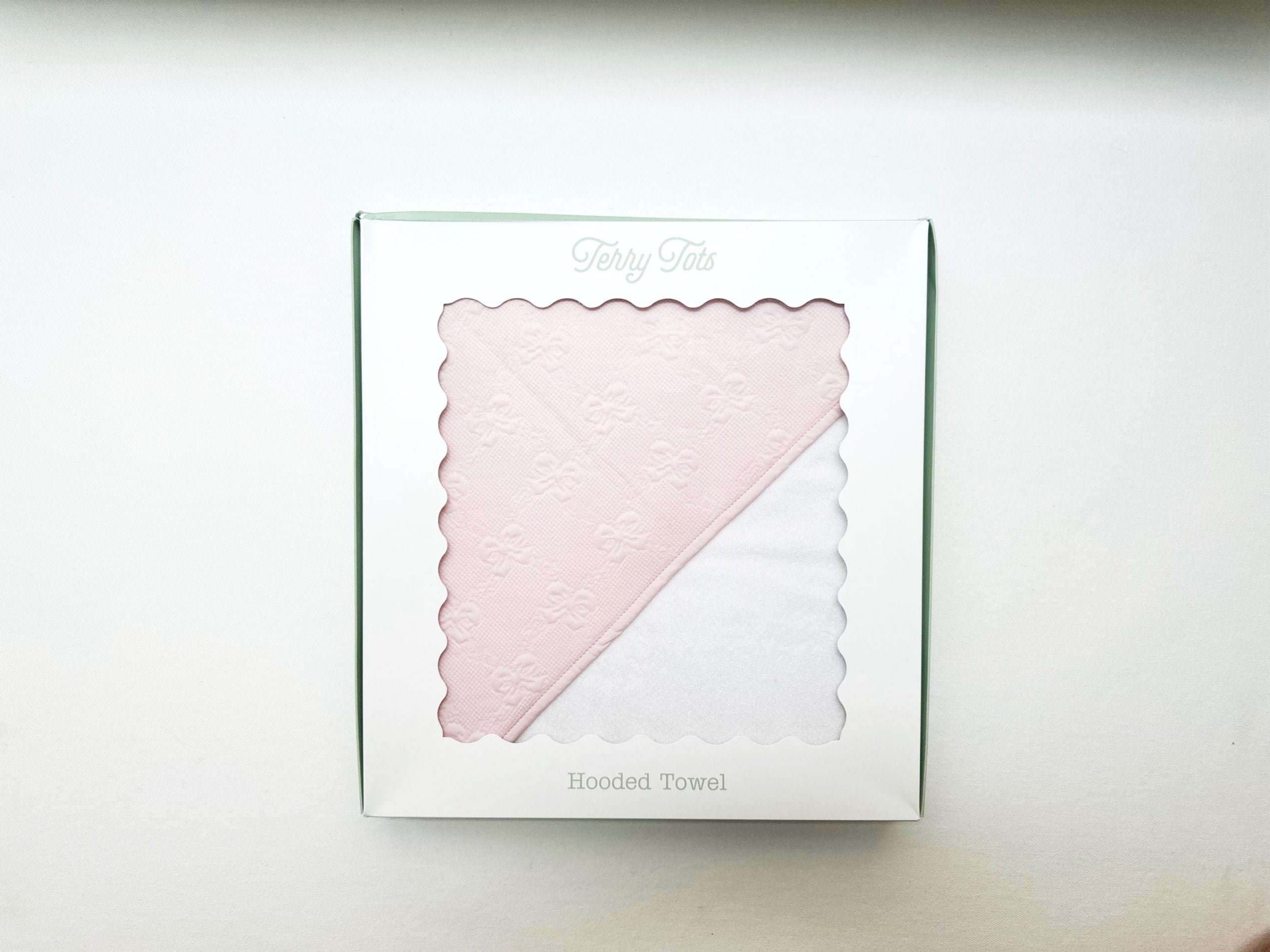 Terry Tots pink jacquard bows hooded towel in gift packaging