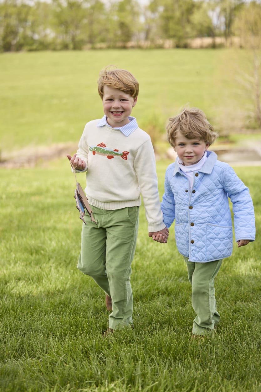 Boy wearing Little English Intarsia Sweater in Brook Trout layered over a Long Sleeve Polo in Light Blue Stripe with Watercress Corduroy Pull On Pants