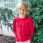 Boy wearing the red Blake long sleeve pocket tee