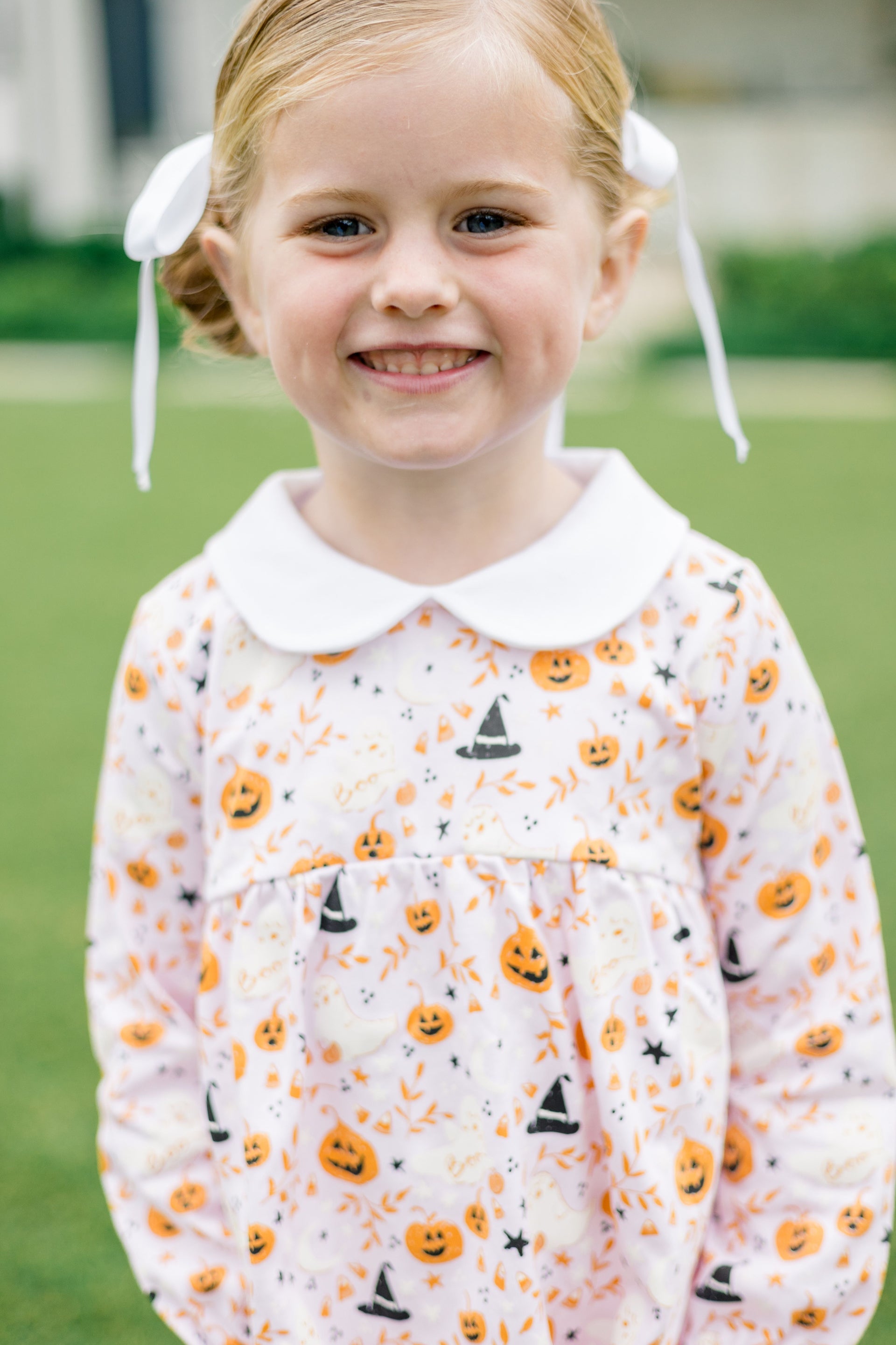 Girl wearing The Proper Peony Pink Casper long sleeve tunic set with ghost print