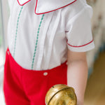 Toddler boy wearing The Proper Peony Holiday Short Set