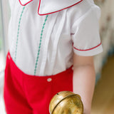 Toddler boy wearing The Proper Peony Holiday Short Set