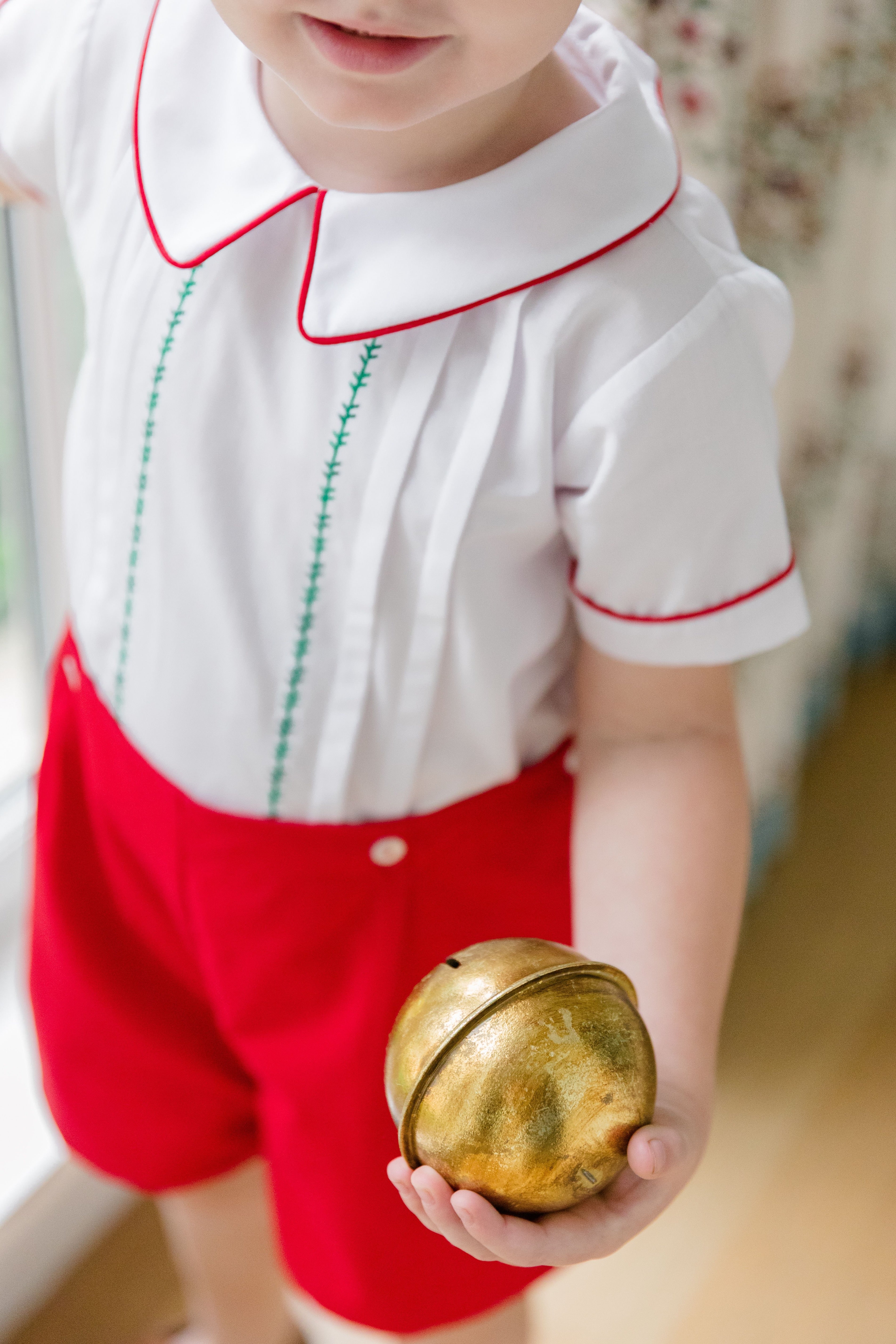 Toddler boy wearing The Proper Peony Holiday Short Set
