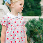 Girl wearing The Proper Peony Apple Blossom tunic set