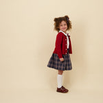Kidiwi Louise smocked skirt in navy plaid, styled with a white Peter Pan collar blouse