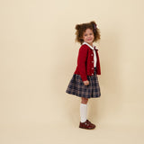 Kidiwi Louise smocked skirt in navy plaid, styled with a white Peter Pan collar blouse