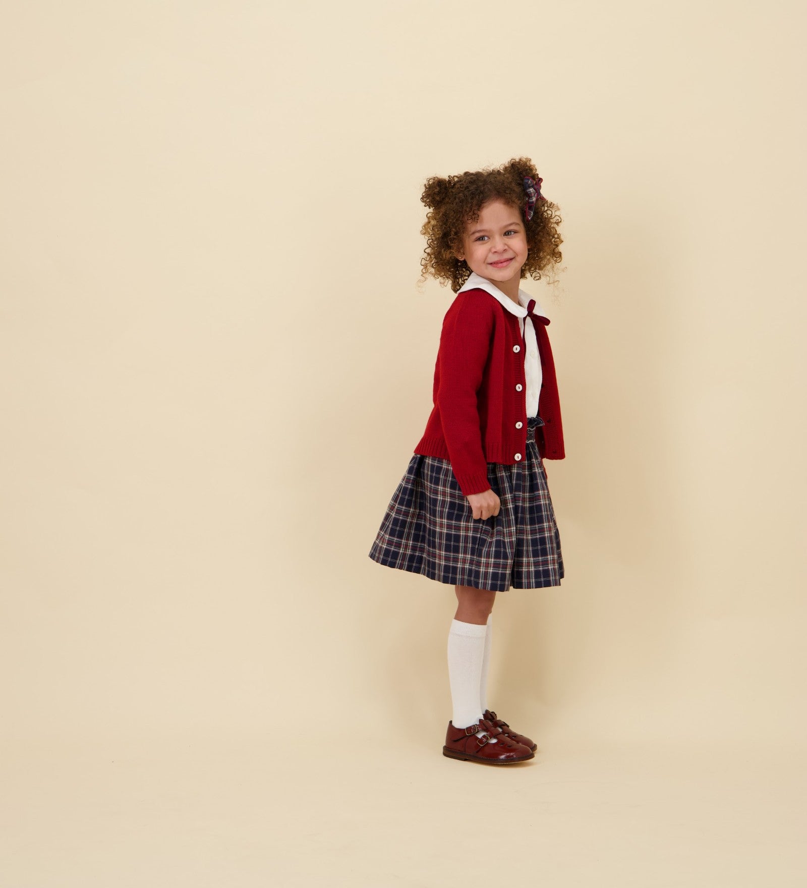 Kidiwi Louise smocked skirt in navy plaid, styled with a white Peter Pan collar blouse