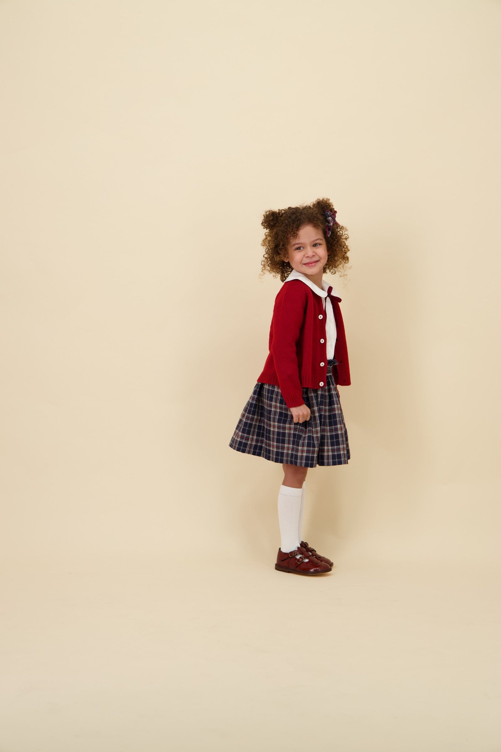 Kidiwi Louise smocked skirt in navy plaid, styled with a white Peter Pan collar blouse
