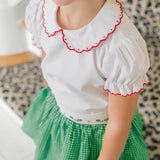 The Proper Peony Carol Christmas Shirt in green and white gingham with holly details