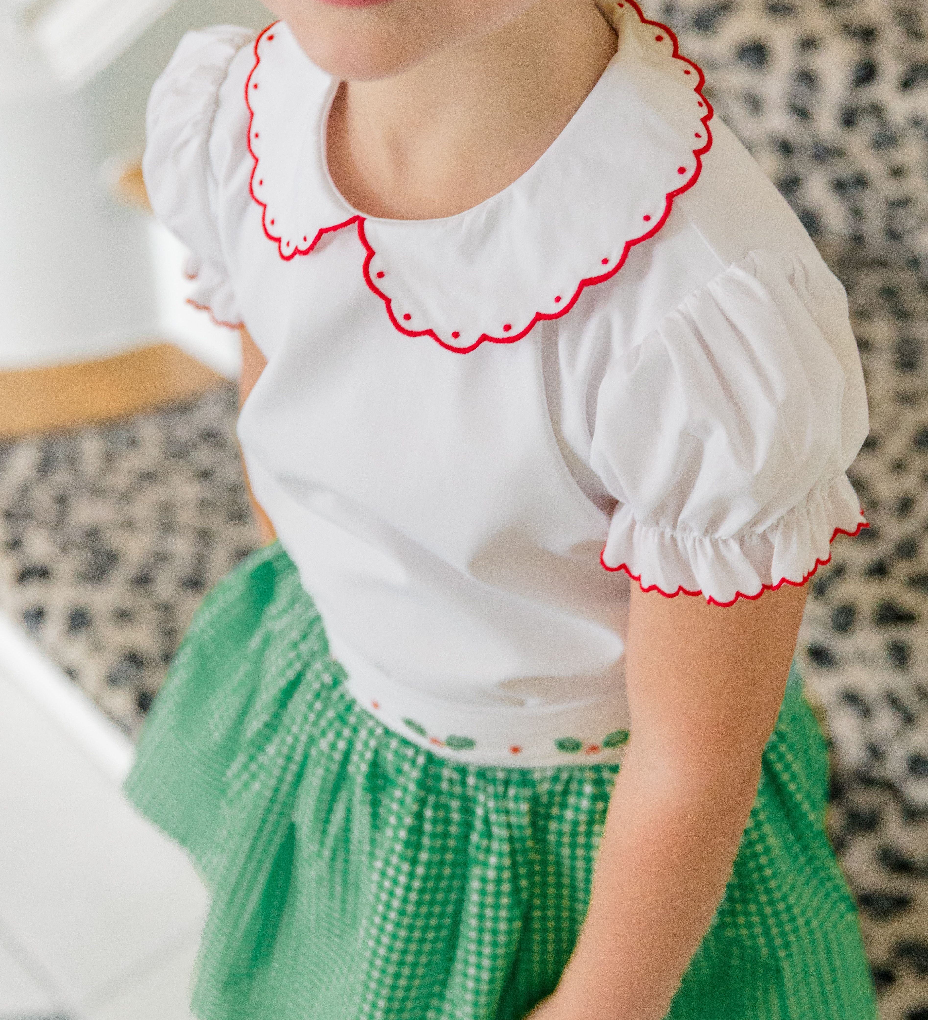 The Proper Peony Carol Christmas Shirt in green and white gingham with holly details