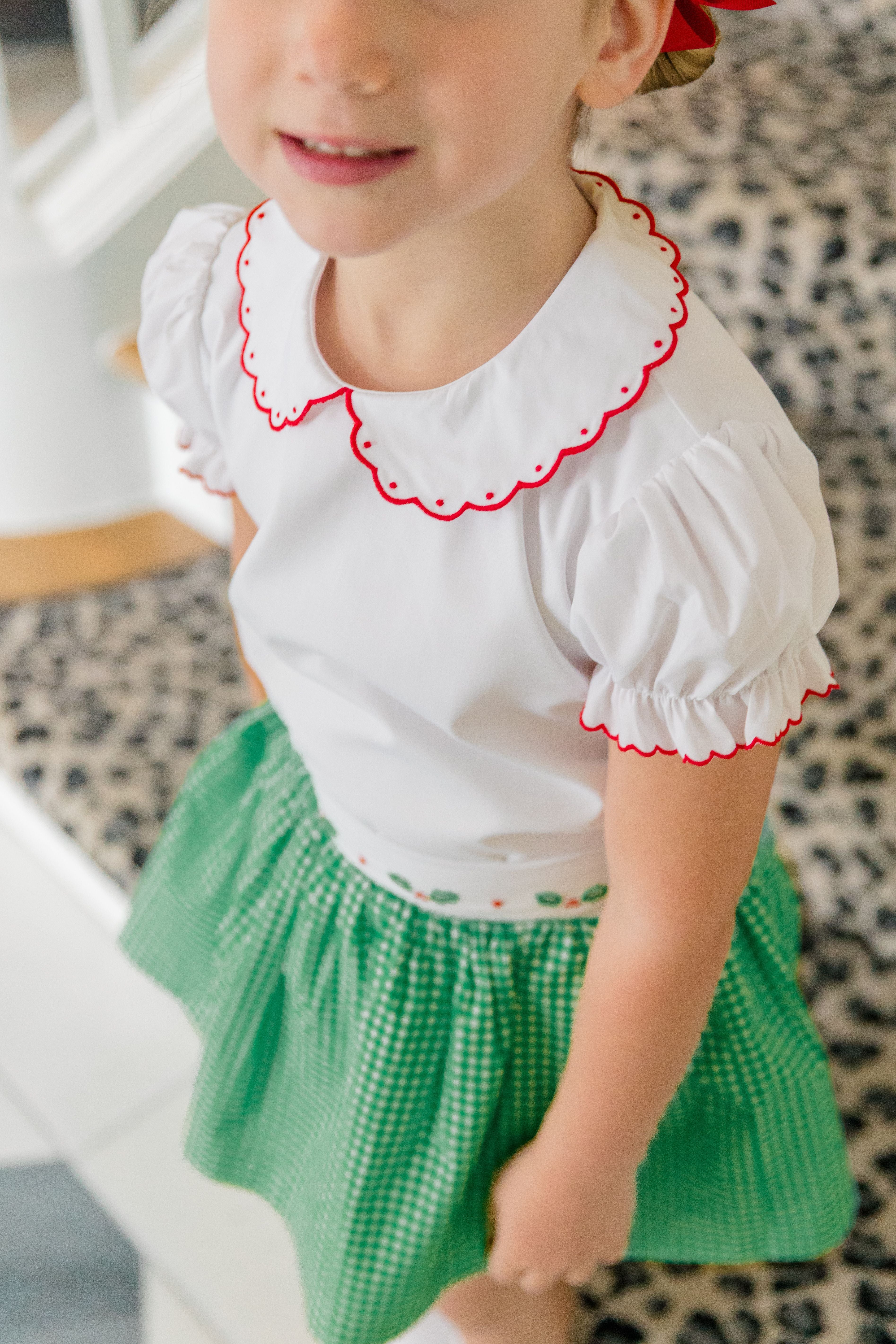 The Proper Peony Carol Christmas Shirt in green and white gingham with holly details