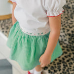 Girl wearing the Carol Christmas Shirt with the matching Carol Christmas Skirt