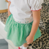 Girl wearing the Carol Christmas Shirt with the matching Carol Christmas Skirt
