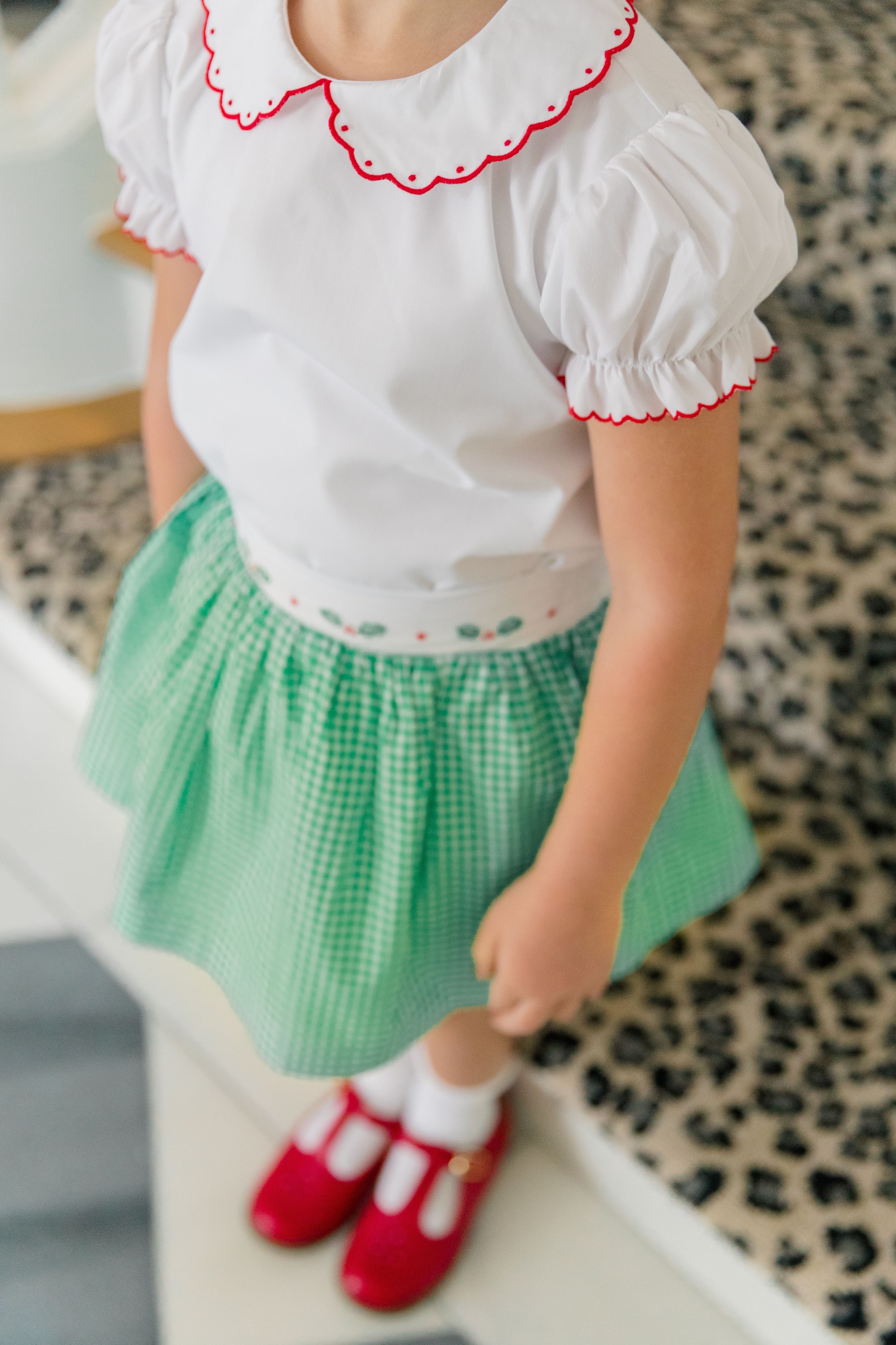 Girl wearing the Carol Christmas Shirt with the matching Carol Christmas Skirt